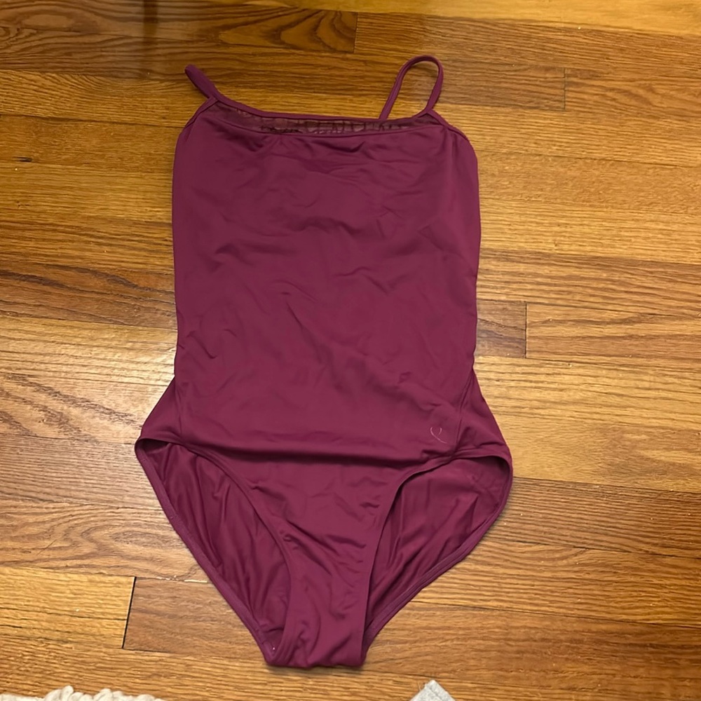 Purple leotard with mesh cutout